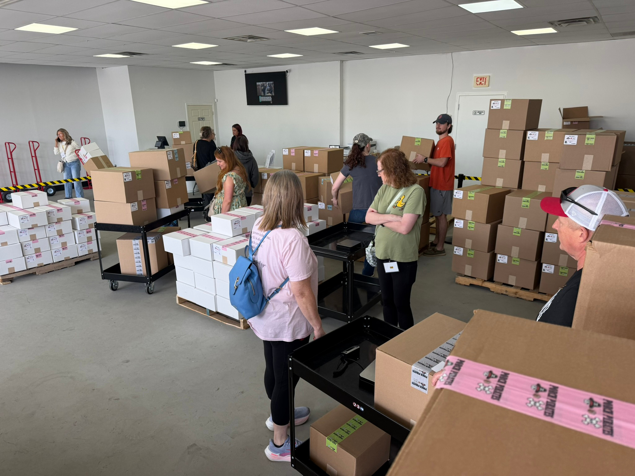 Busy store floor with shoppers picking out mystery boxes