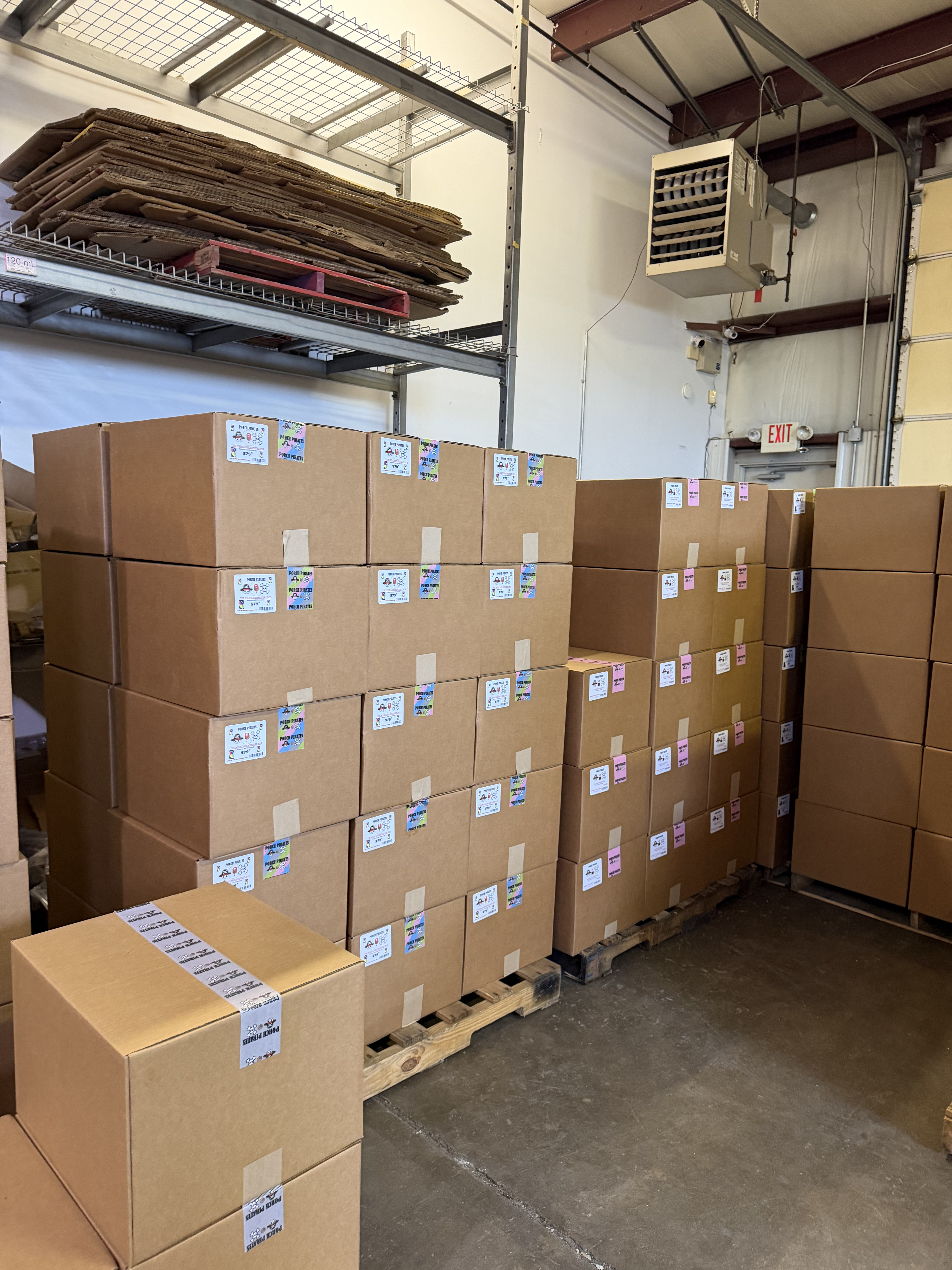 Two full pallets of sealed mystery boxes in the warehouse