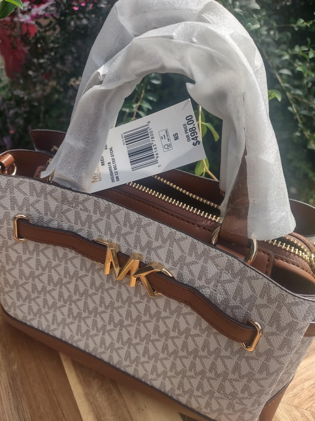 Customer photo of a Michael Kors satchel with its 498 dollar tag