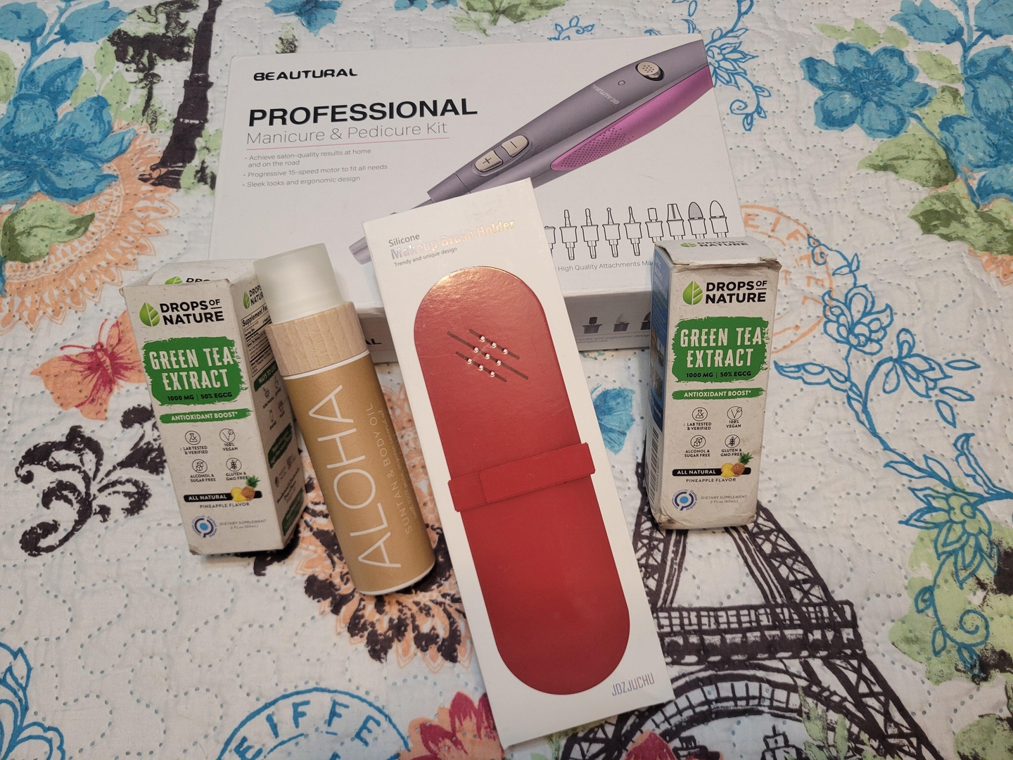 Customer photo of beauty products from a mystery box spread on a bed