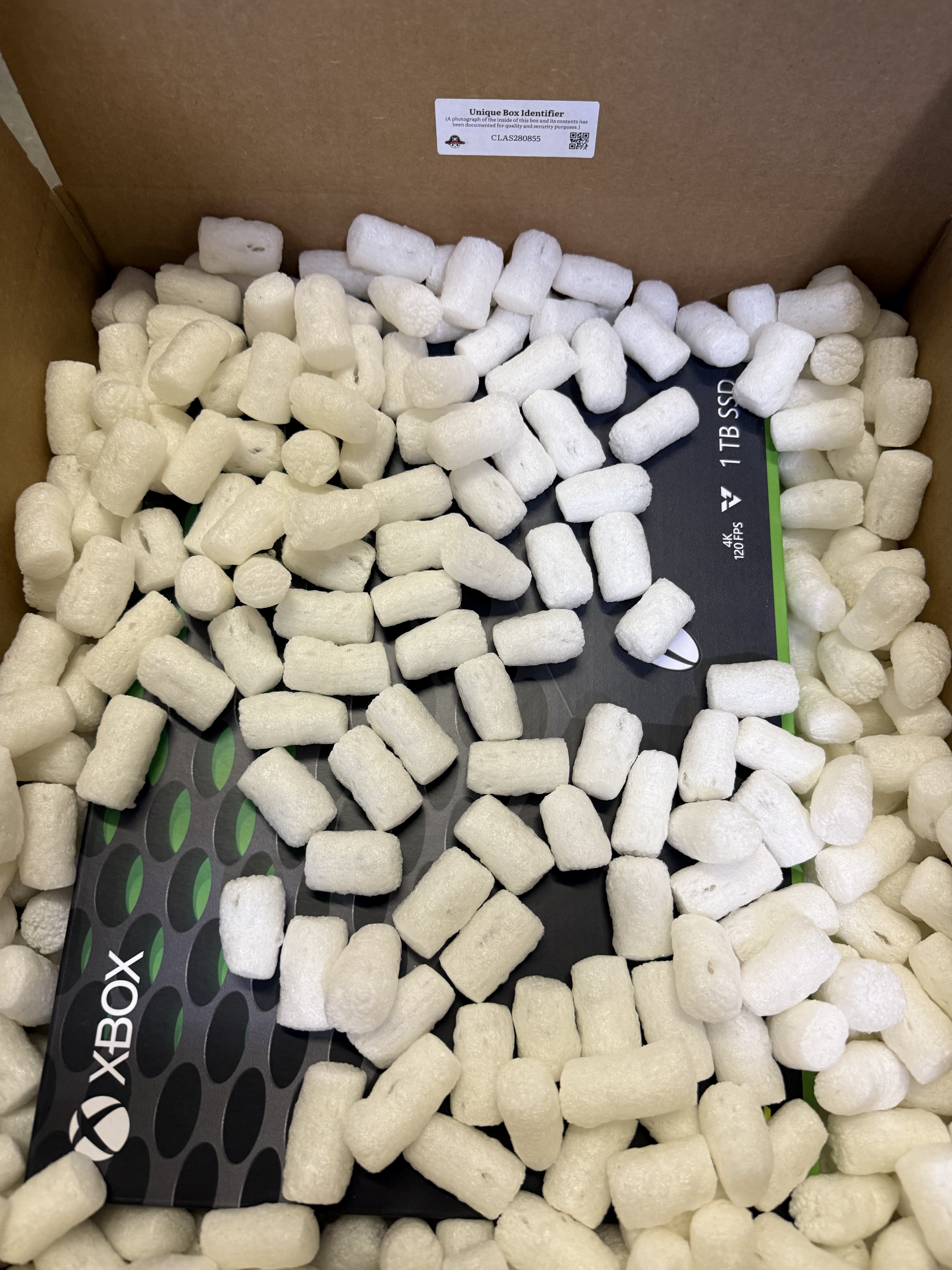 An Xbox Series X packed inside a mystery box